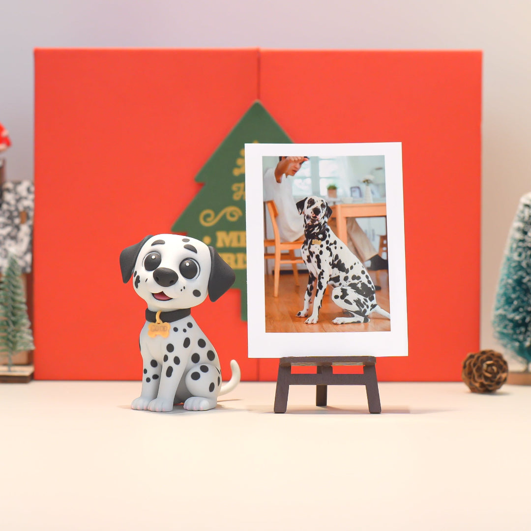 Dalmatian figurine next to a photo frame with a dalmatian on a stand against a red background.