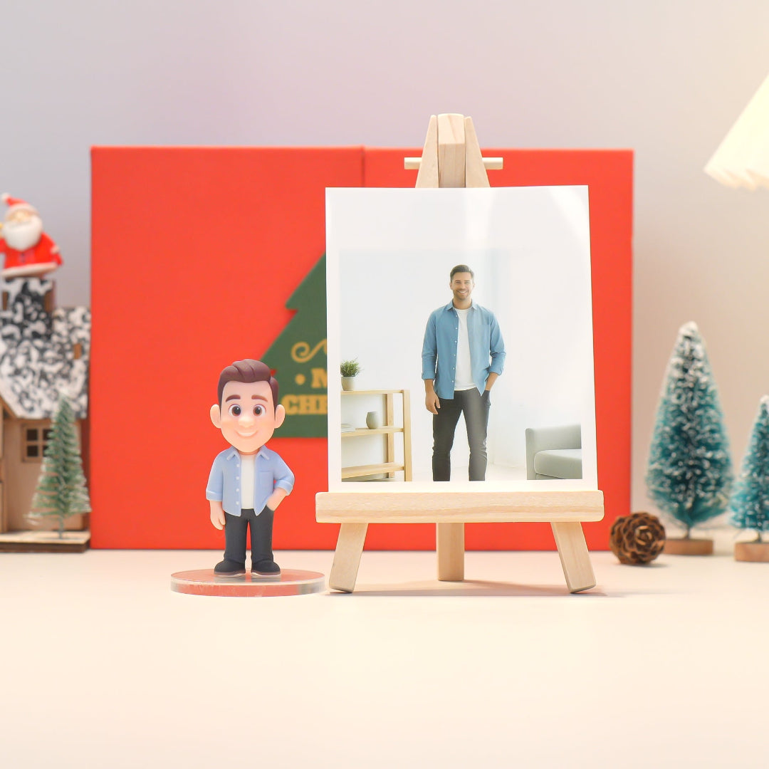 Figurine of a man standing next to a painting of a man on an easel with a Christmas-themed background.