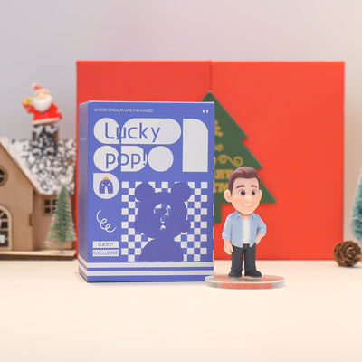 Lucky Popo figurine with packaging in front of a red box and Christmas decorations.