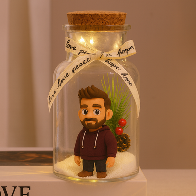 Glass jar with a figurine, lights, and decorative elements on a neutral background