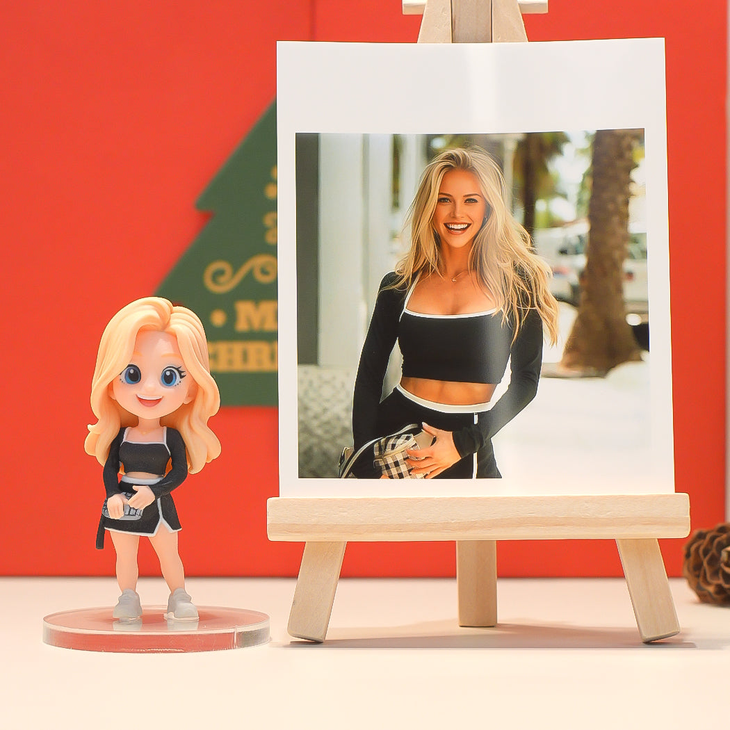 Figurine of a woman in athletic wear next to a photo of a woman on an easel against a red background.