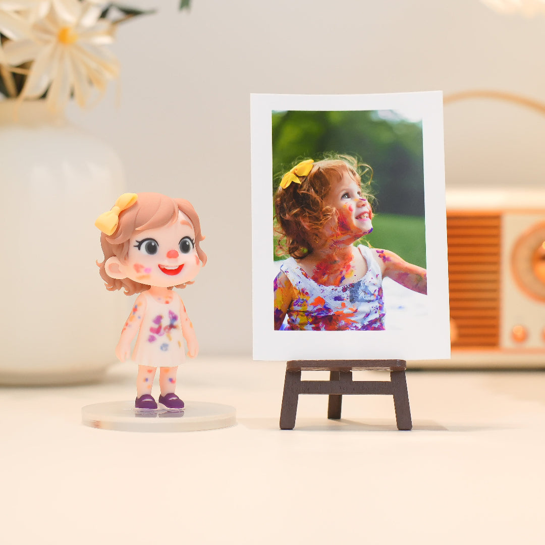 Small figurine of a girl next to a framed photo of a young girl outdoors.