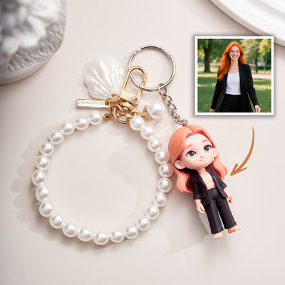 Pearl bracelet with a keychain featuring a doll with red hair, next to a photo of a woman with red hair.