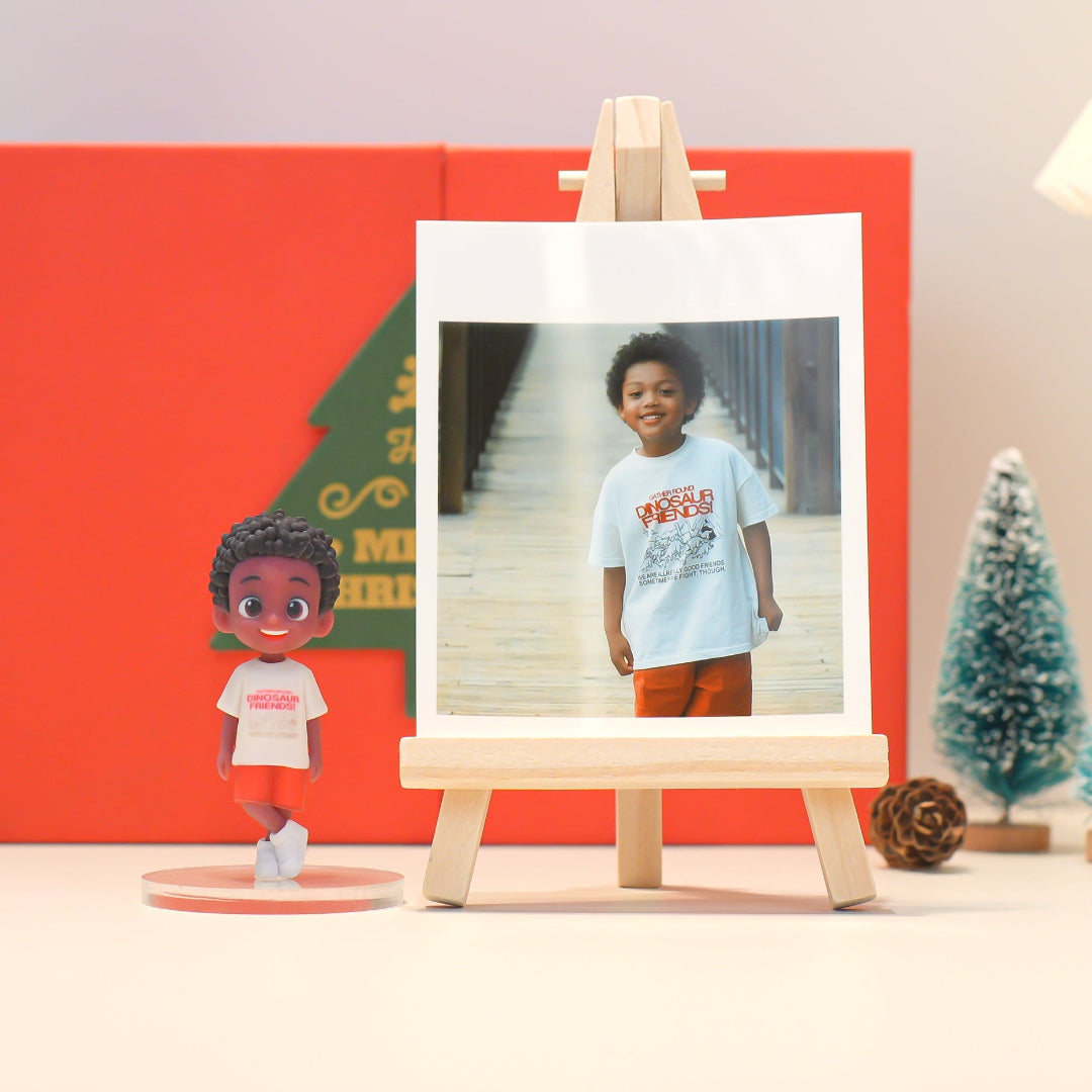 Child's photo on a small easel with a toy figure in front of a red background
