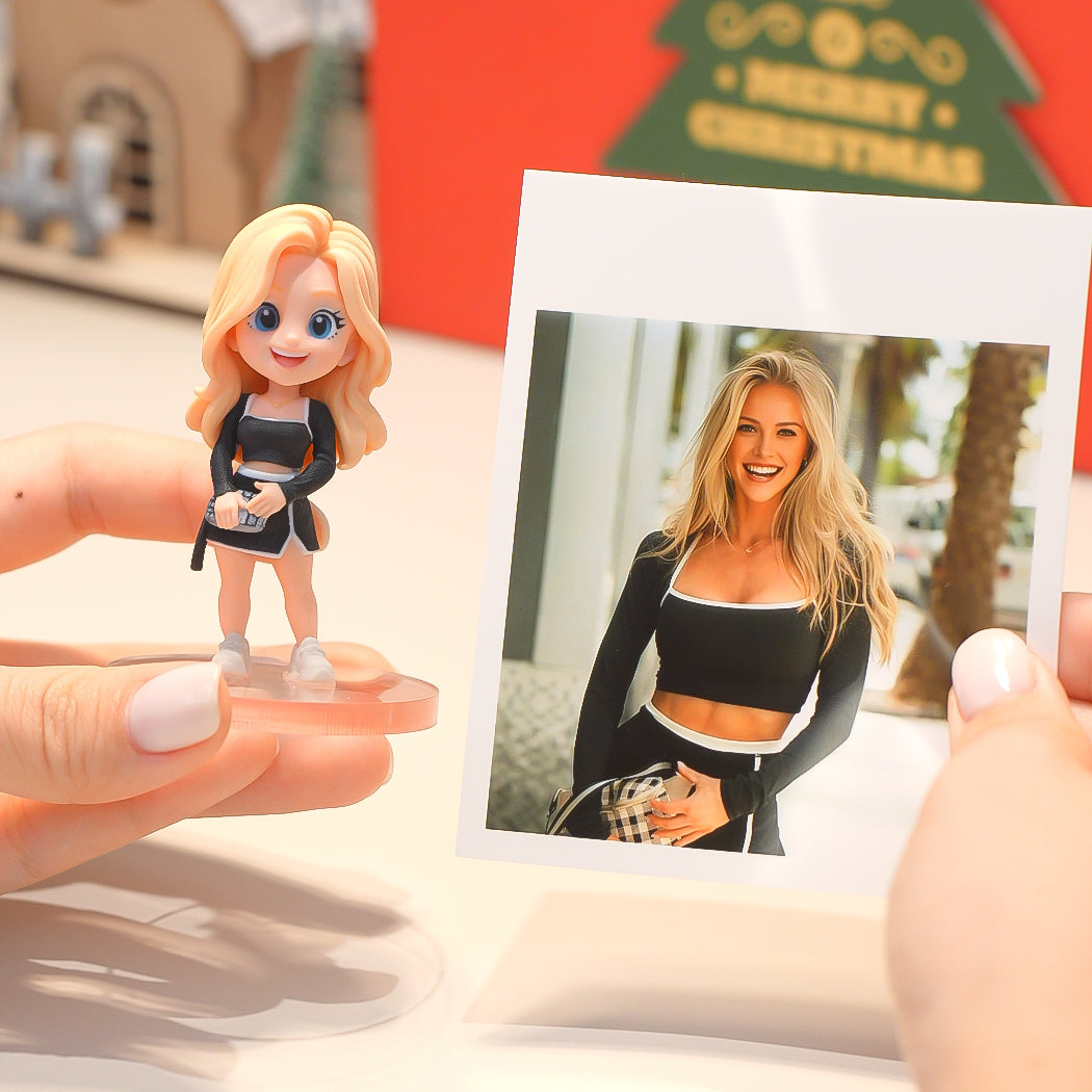 Person holding a figurine of a blonde woman and a photo of the same person outdoors.