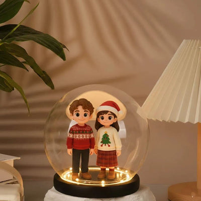 Two people in Christmas-themed sweaters inside a glass dome on a warm-toned background