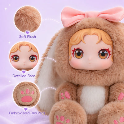 A close-up of a personalized stuffed animal showing the detailed hand-finished resin face and soft plush hood